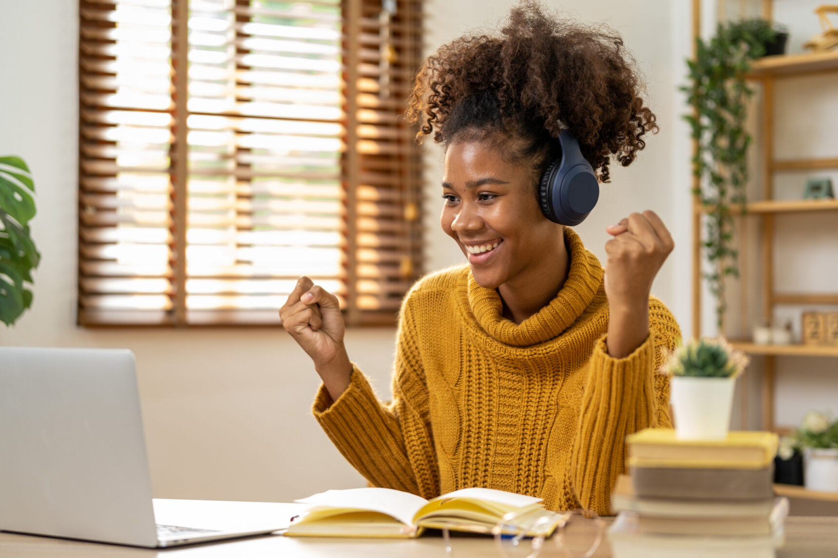 A Level Biology student smiling during online tutoring session.