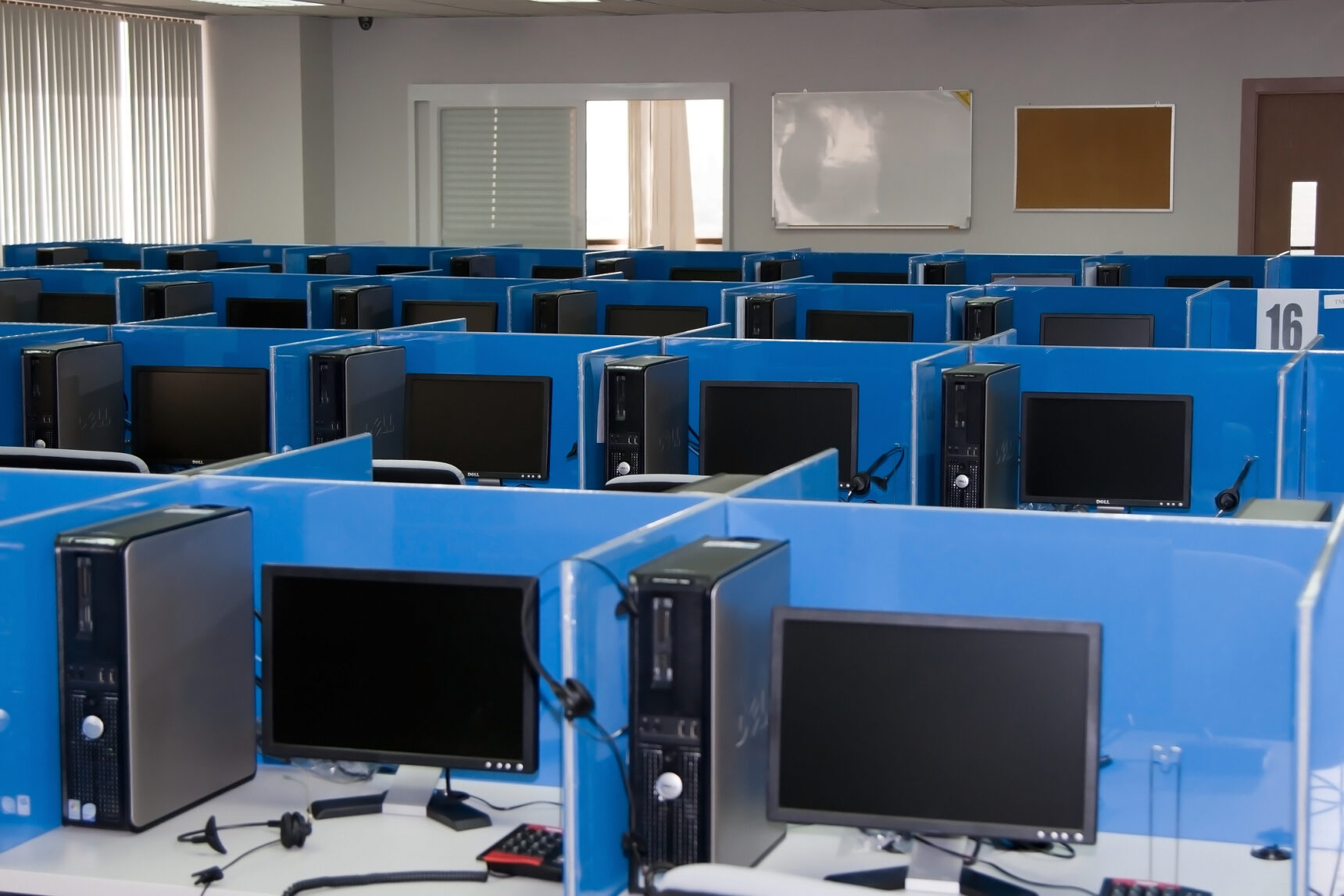 Example Oxford PAT 2024 test centre with computers separated by partions.