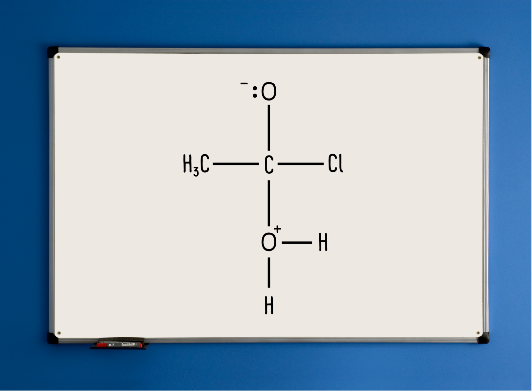 Organic reaction mechanism intermediate compound on mini whiteboard.