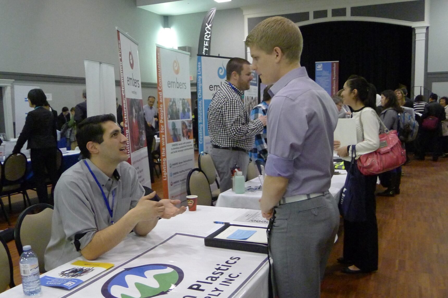 Students talking to employers at a careers fair