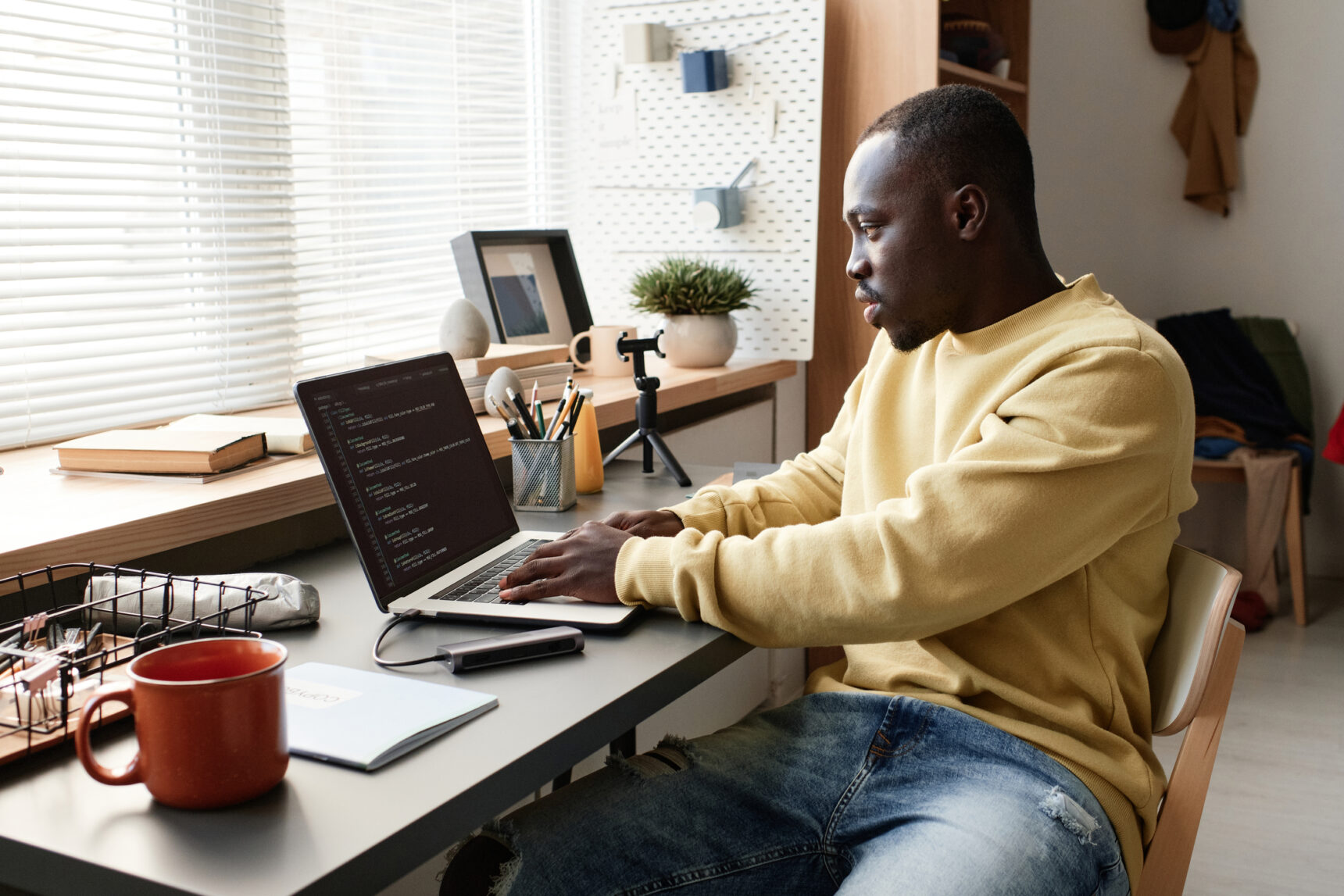 Male student on laptop.