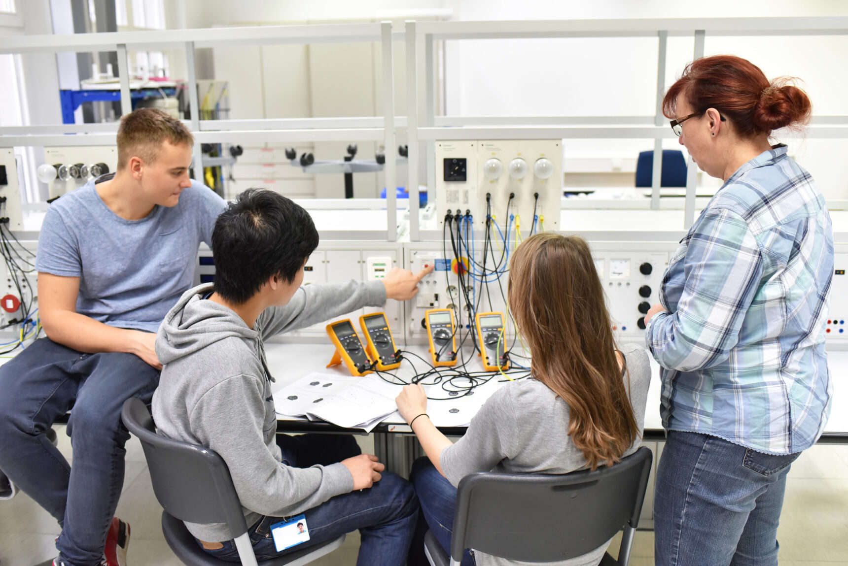 T Level Transition Programme pupils exploring circuits under supervision.