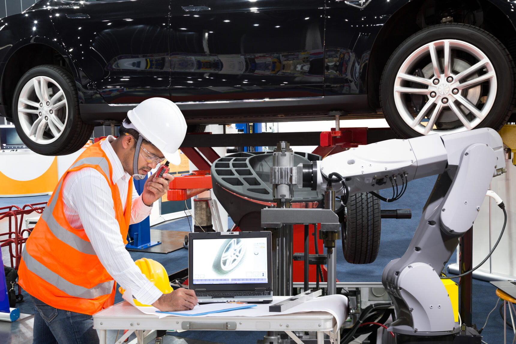 Automotive engineer working with machines to improve the car’s functionality