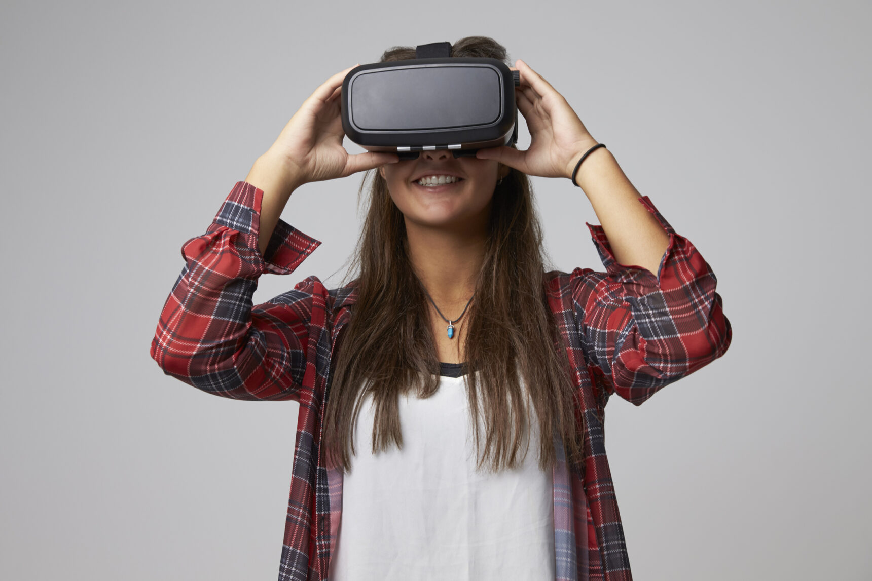 Smiling girl wearing a VR headset