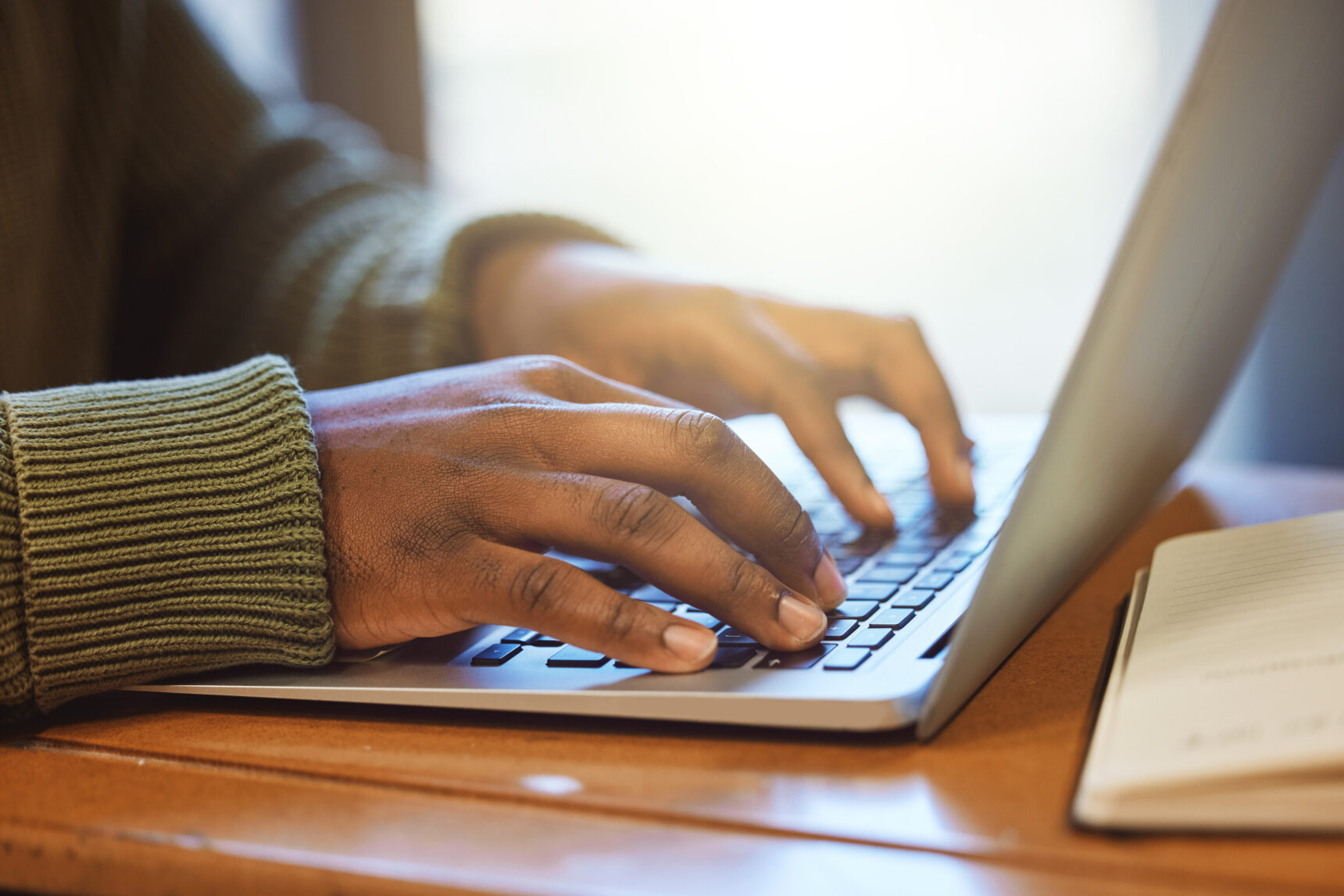 Hands typing. Searching for sponsored degrees.