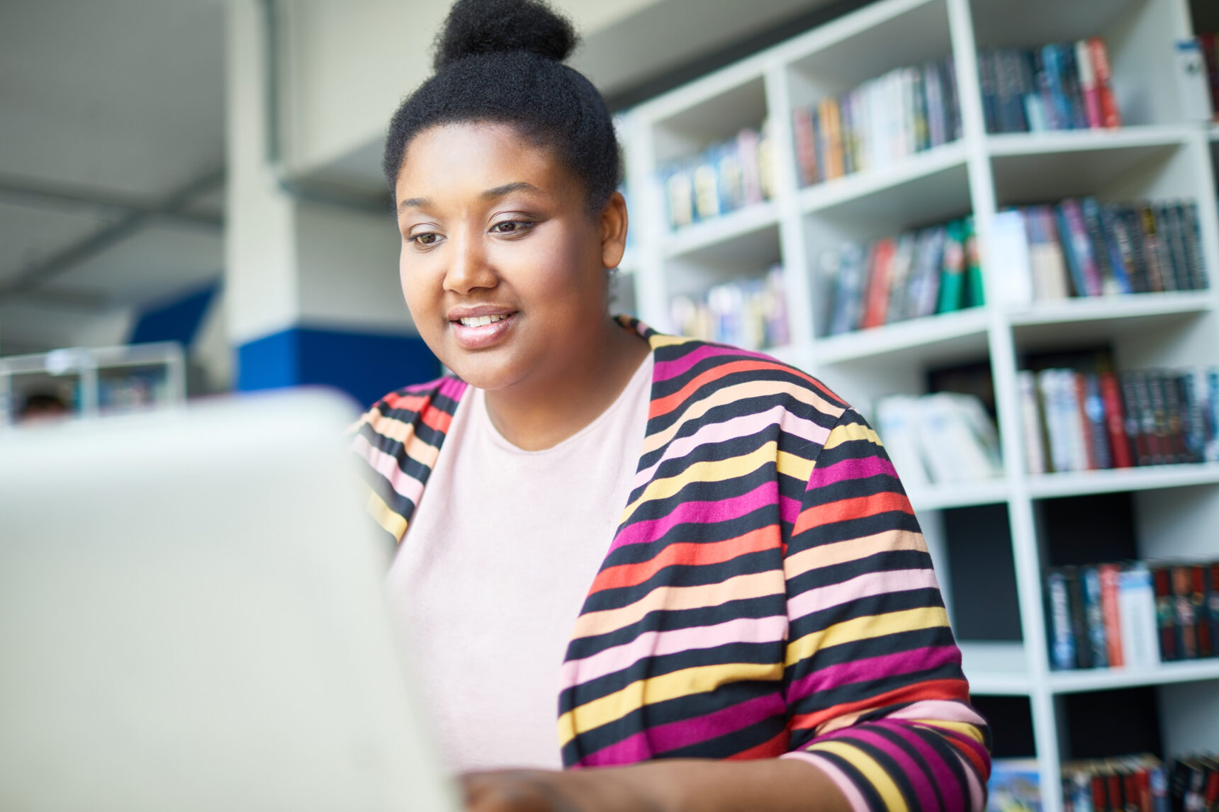 Female student researching gap year activities.