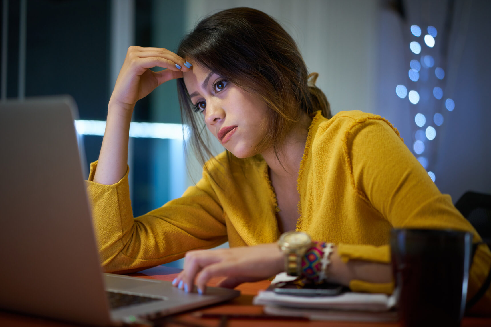 Anxious student revising at their laptop.